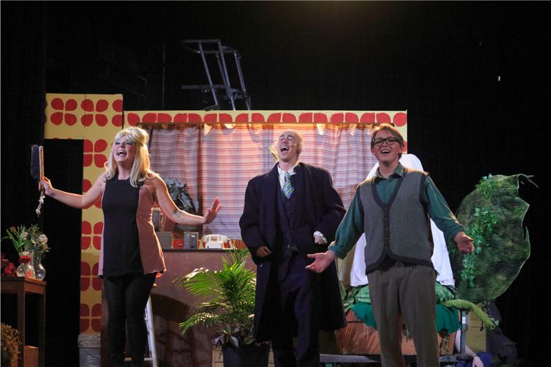 Three University of Guelph student actors perform on stage in a production of Little Shop of Horrors at War Memorial Hall at U of G. Left to right: Alyssa Boyle, Music major, playing Audrey; Luka Burazin, Bachelor of Commerce student, playing Mushnik and Liam Wesley, Music major, playing Seymour.